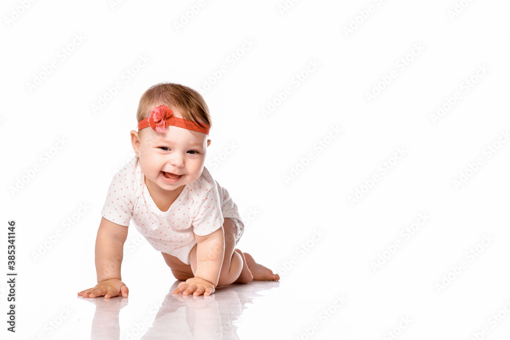 little baby girl laughing, creeping playing in the studio, isolated on white background little baby girl laughing, creeping playing in the studio, isolated on white background