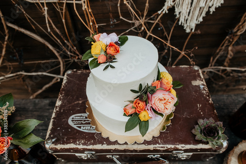 wedding cake strewn with berries, raspberries, blueberries, blueberries, pastry, sweetness, boho-style dessert photo