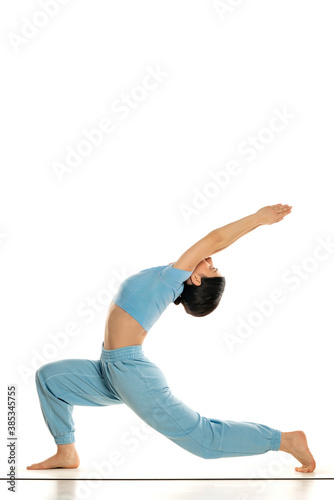 Young fit yoga woman doing yoga pose, isolated on white background.