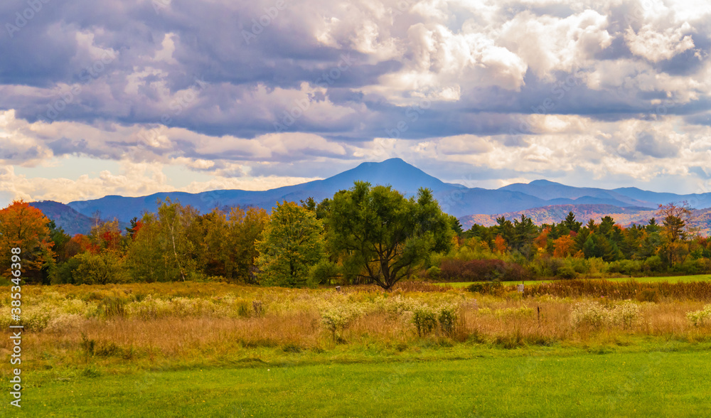 view of Camels Hump Mountain in fall foliage season, in Vermont
