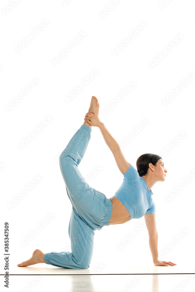 Fit yoga woman doing yoga pose, isolated on white background. Fit yoga woman doing yoga pose, isolated on white background.