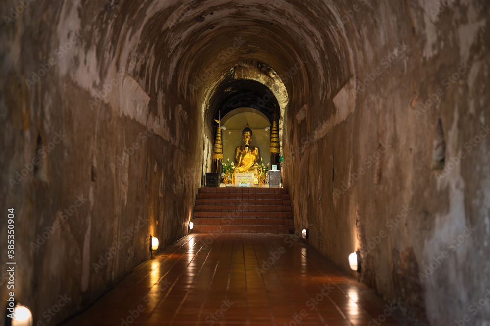 Wat Umong Suan Phutthatham Buddha statue in tunnel The temple was built in 1297 located in Chiang Mai Thailand