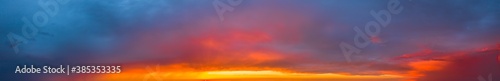 Bright and intense Panorama twilight cloudy sky. Evening background image