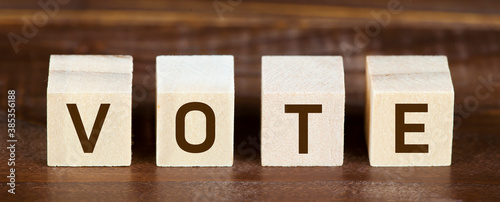 Wooden cubes with vote text. Presidental US 2020 election, voting concept. Web banner. photo