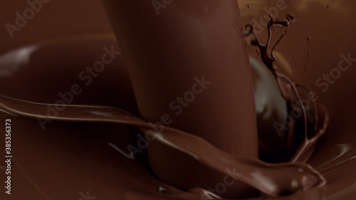 Detail of pouring hot chcocolate with splash photo