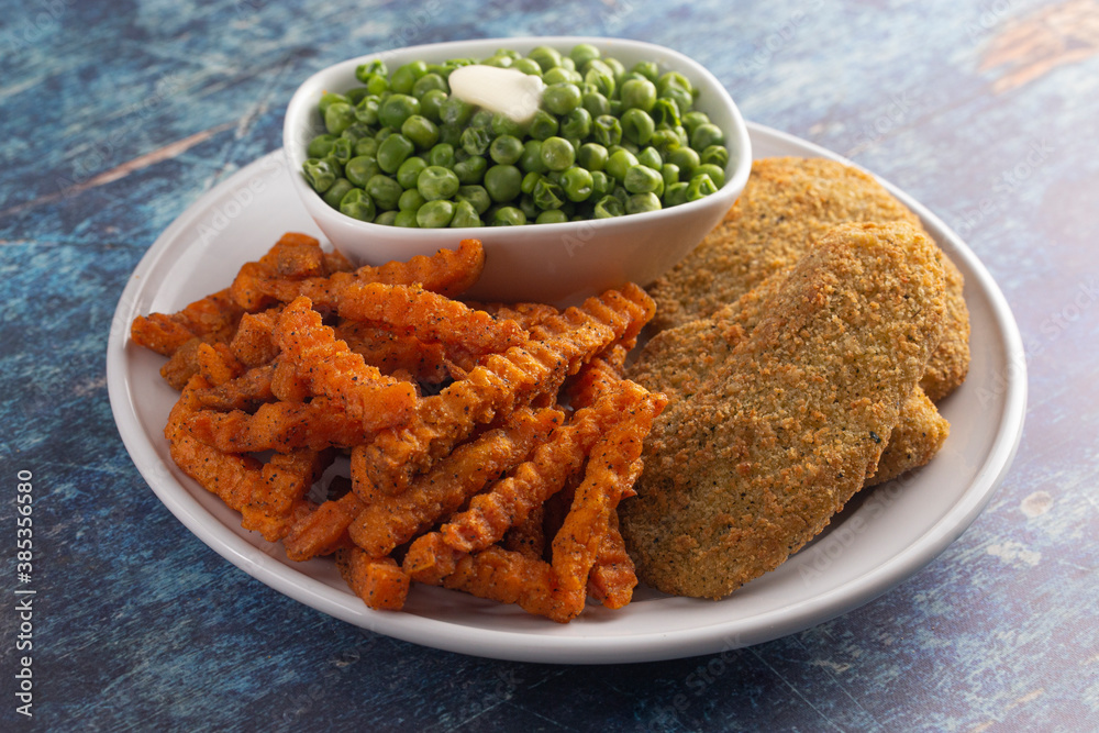 Meal of Breaded Fish Sweet Potato Fries and Peas Meal of Breaded Fish Sweet Potato Fries and Peas