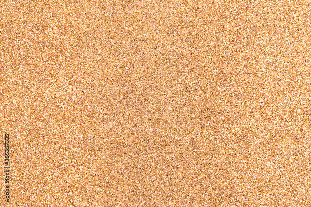 Shiny bronze background. Golden glitter. Golden glitter paper. Festive background, abstraction. Shiny bronze background. Golden glitter. Golden glitter paper. Festive background, abstraction.
