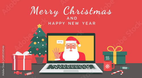 Santa Claus hand greeting via video calling on the laptop with Merry Christmas and happy new year lettering, cartoon character vector flat illustration