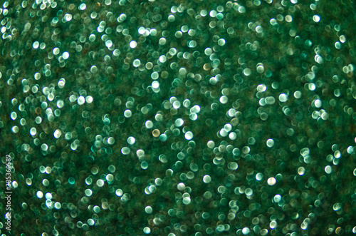 Unframed abstract background green glitter. sparkles