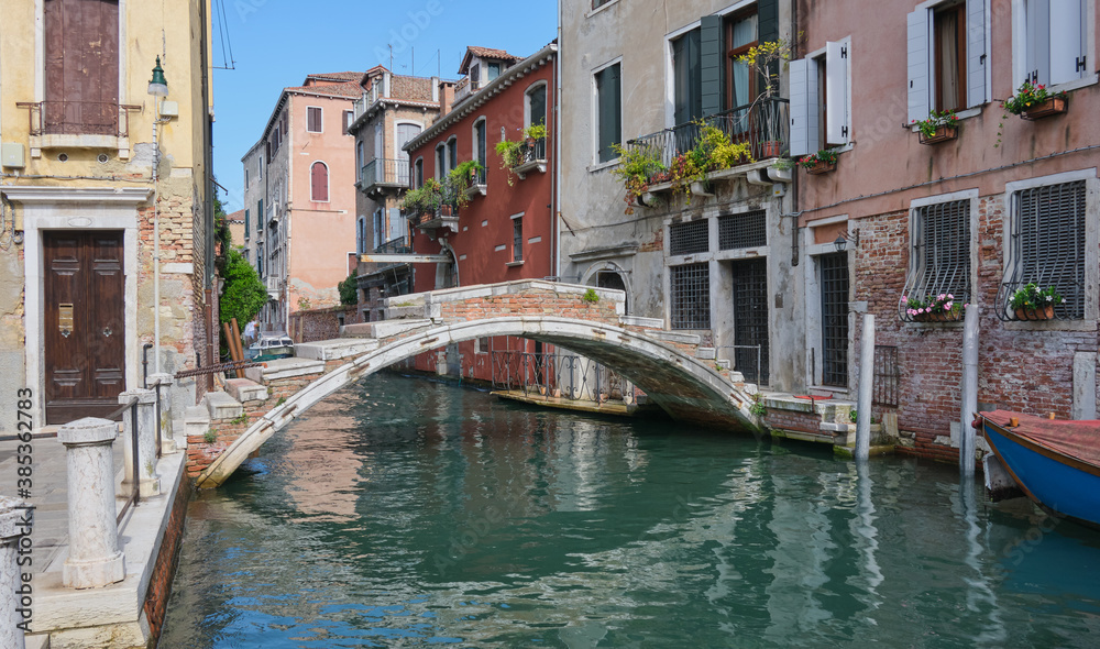 the old Chiodo bridge in the bright afternoon sun in Venice Cannaregio, tourist selfie destination