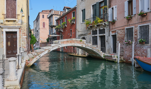 the old Chiodo bridge in the bright afternoon sun in Venice Cannaregio, tourist selfie destination © tilialucida