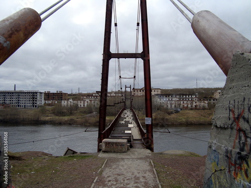 pedestrian suspension bridge, an abandoned place in Russia, the North town of Vorkuta photo