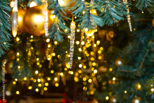 Christmas tree decoration with lights. Selectable focus with beautiful bokeh and blur. © Nikkeero