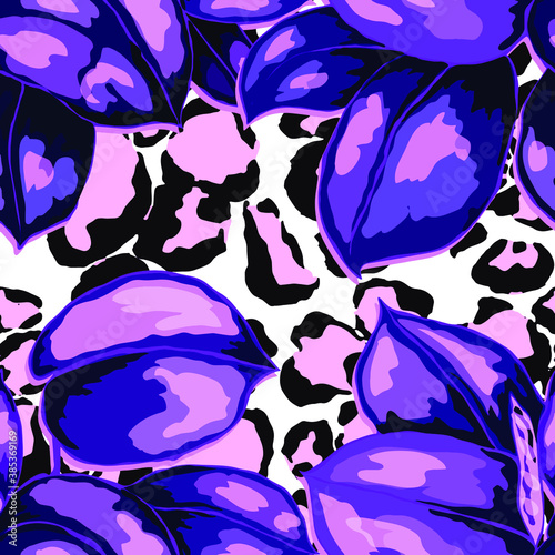 Tropical seamless pattern on animalistic texture. Jungle exotic summer print. Summer tropical leaf. Tropical flower fashion pattern. Floral tropic illustration. Vector seamless pattern.