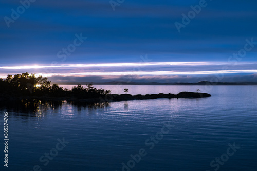Seascape with small island in Stockholm archipelago at night