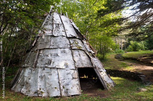 View of a traditional wooden tipi in Canada