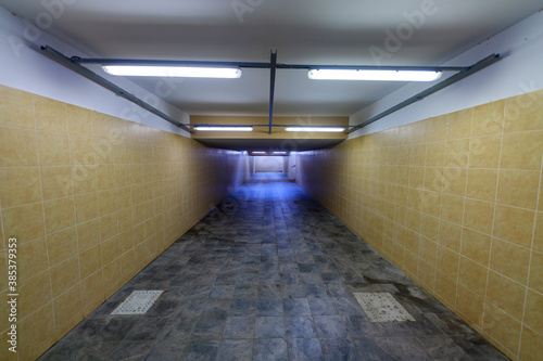 Underground passage to the train station platform. Infrastructure for traveling passengers.