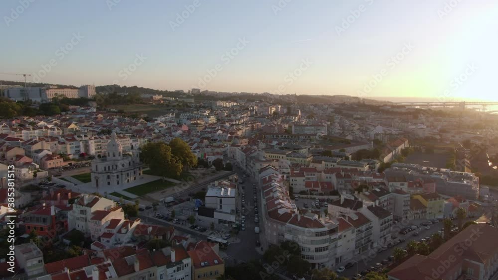 Aerial view of Lisbon, Portugal, flying over the historic Ajuda neighbourhood at sunrise. Aerial view of Lisbon, Portugal, flying over the historic Ajuda neighbourhood at sunrise.