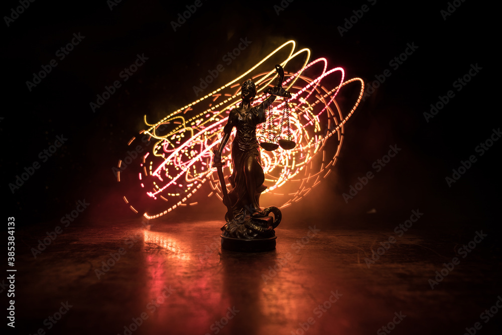 The Statue of Justice - lady justice or Iustitia / Justitia the Roman goddess of Justice on a dark fire background