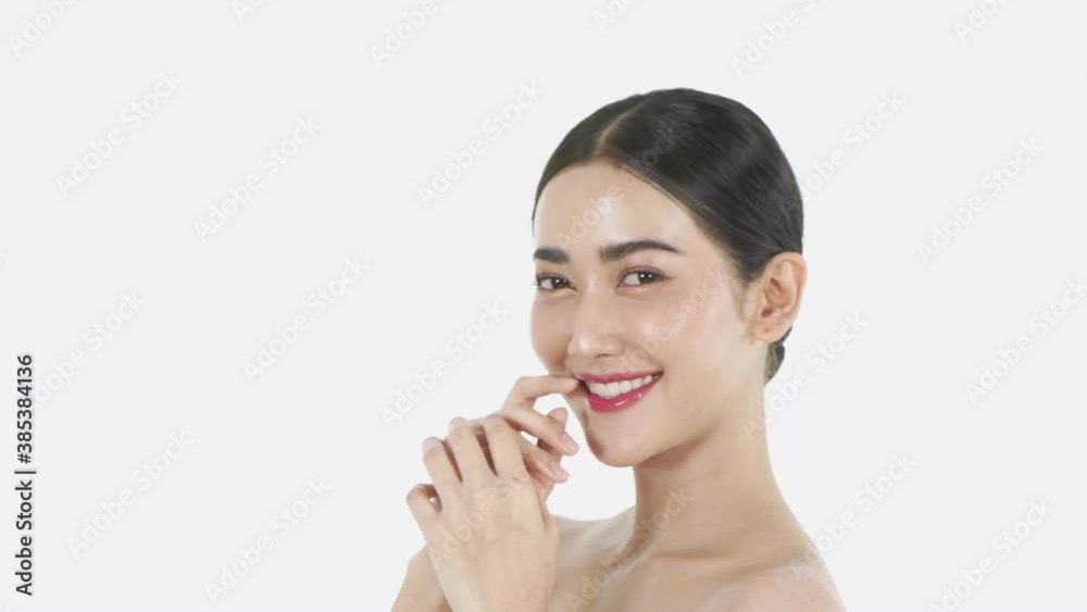 Beauty concept. Young Asian woman smiling charmingly on a white background. 4k Resolution. Beauty concept. Young Asian woman smiling charmingly on a white background. 4k Resolution.