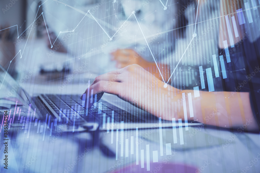 Multi exposure of woman hands typing on computer and financial graph hologram drawing. Stock market analysis concept. Multi exposure of woman hands typing on computer and financial graph hologram drawing. Stock market analysis concept.