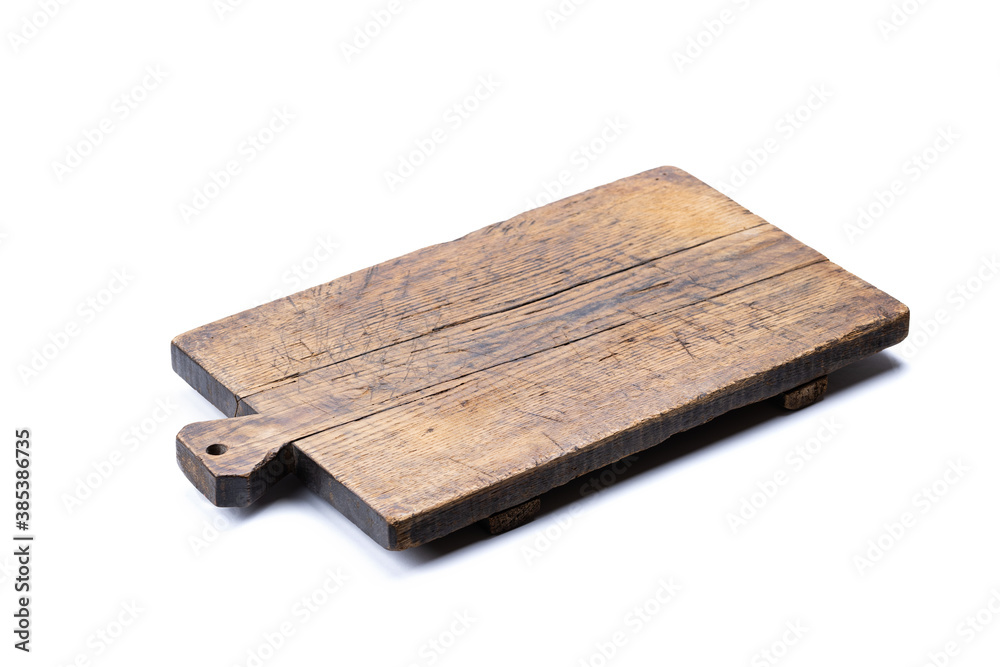 Fototapeta premium old rustic cutting board isolated on a white background. backdrop element for food design