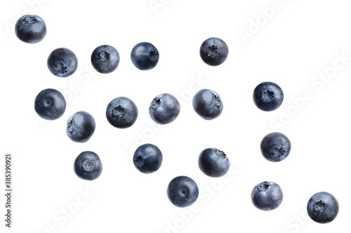 Fresh whole blueberries falling on white background