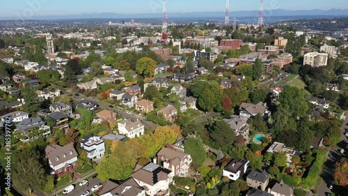 Aerial / drone footage of the top of Queen Anne Hill, an upscale, affluent residential neighborhood uptown by Puget Sound, in Seattle, Washington photo