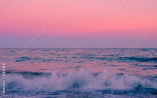 Foggy Twilight Seascape over the Horizon on Martha's Vineyard in Autumn. Selective focus image with motion blur of the dancing waves.