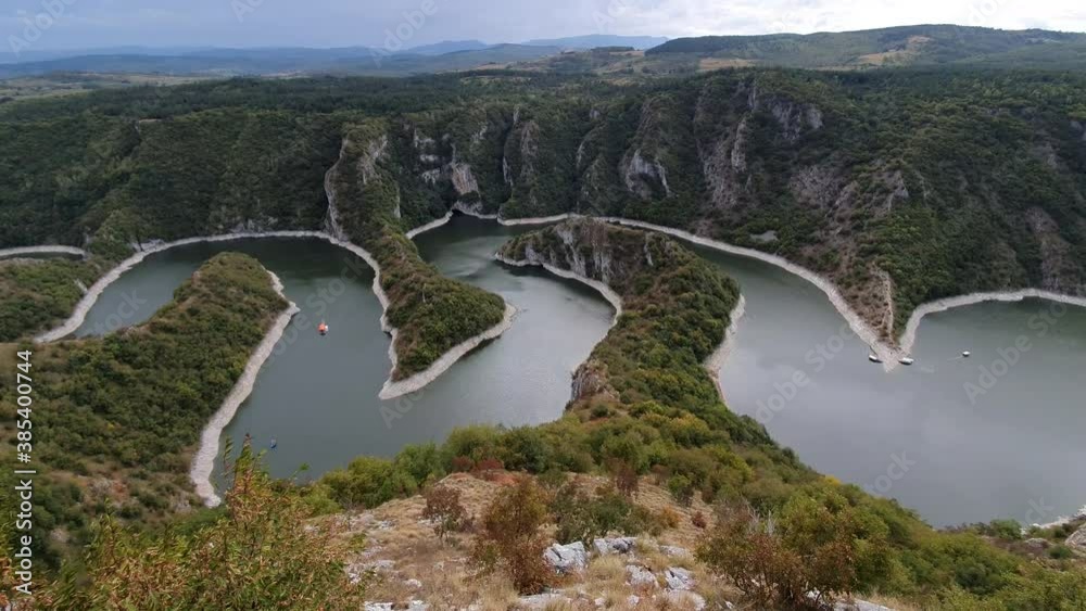 Meanders of Uvac River in Nature Reserve, Serbia. Scenic Home of Griffon Vulture, Panoramic View on Cloudy Day Meanders of Uvac River in Nature Reserve, Serbia. Scenic Home of Griffon Vulture, Panoramic View on Cloudy Day