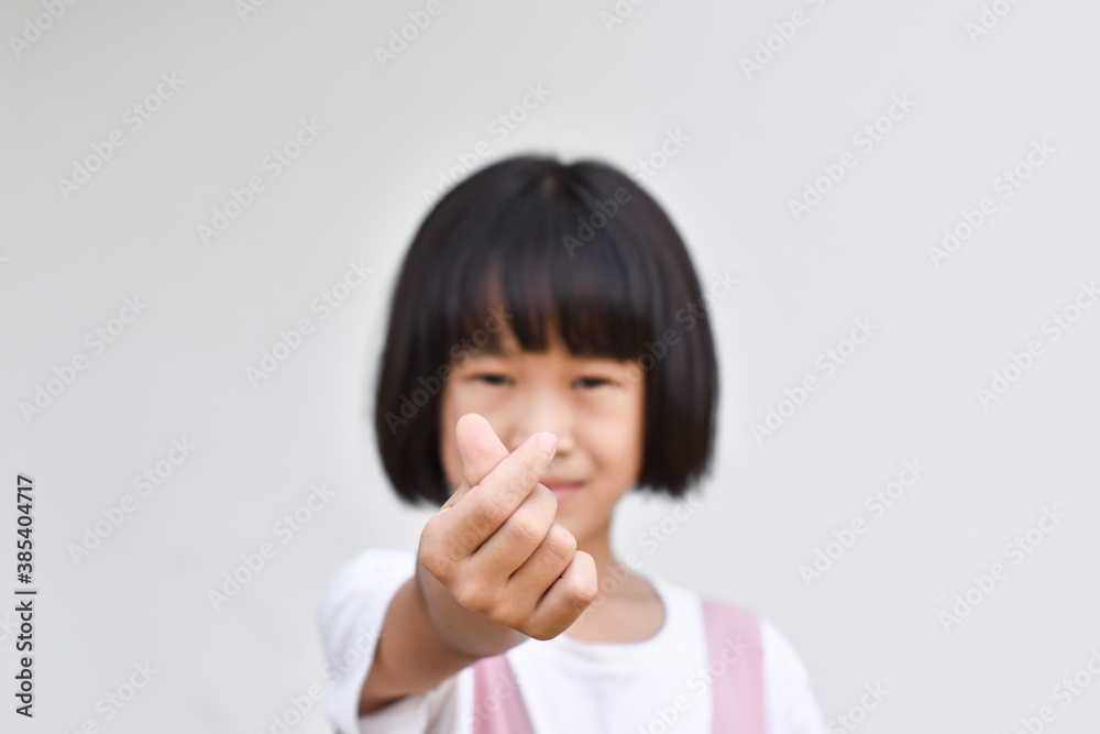 Child girls hands making small heart. Love and happiness concept. Selective focus on hand. Child girls hands making small heart. Love and happiness concept. Selective focus on hand.