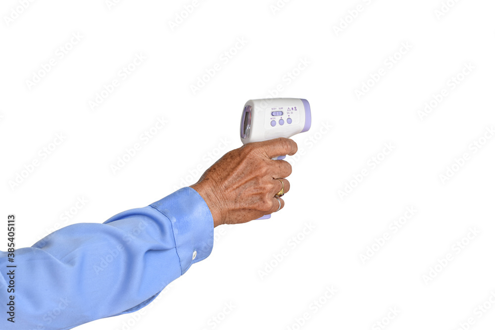Hands of an elderly man holding infrared thermometer (thermometer gun) Isolated on white background. Senior male wrinkled hand with clipping path. Hands of an elderly man holding infrared thermometer (thermometer gun) Isolated on white background. Senior male wrinkled hand with clipping path.