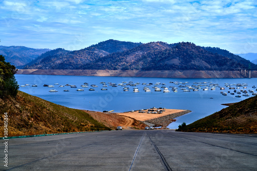 Scenic view of Lake Oroville Boat Ramp, Boat houses, and Mountain View in California.  photo