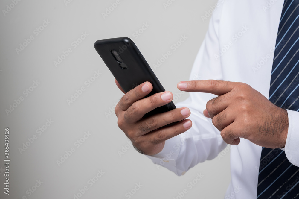 Fototapeta premium Close up businessman hands using smartphone to online social network shopping online and other.