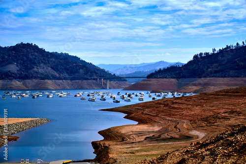 Scenic view of Lake Oroville Dam, lake boathouses and mountain view in Lake Oroville California . photo