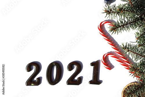 fir branches with Christmas decorations lie on a white background with a place for tex