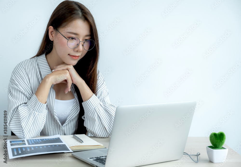 Young Asian teachers are teaching fun online from their home office, social distancing teaching concept during COVID virus diseases Young Asian teachers are teaching fun online from their home office, social distancing teaching concept during COVID virus diseases