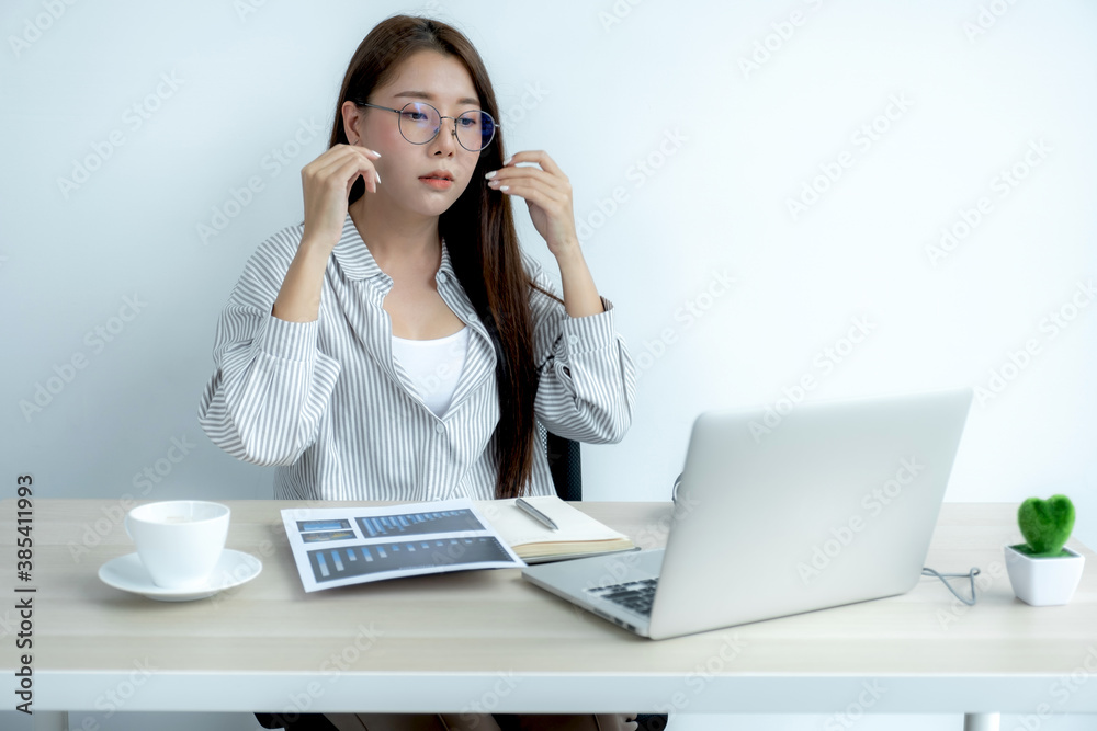 Young Asian teachers are teaching fun online from their home office, social distancing teaching concept during COVID virus diseases Young Asian teachers are teaching fun online from their home office, social distancing teaching concept during COVID virus diseases