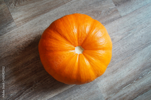 Orange pumpkin on the wooden floor.  Halloween.   