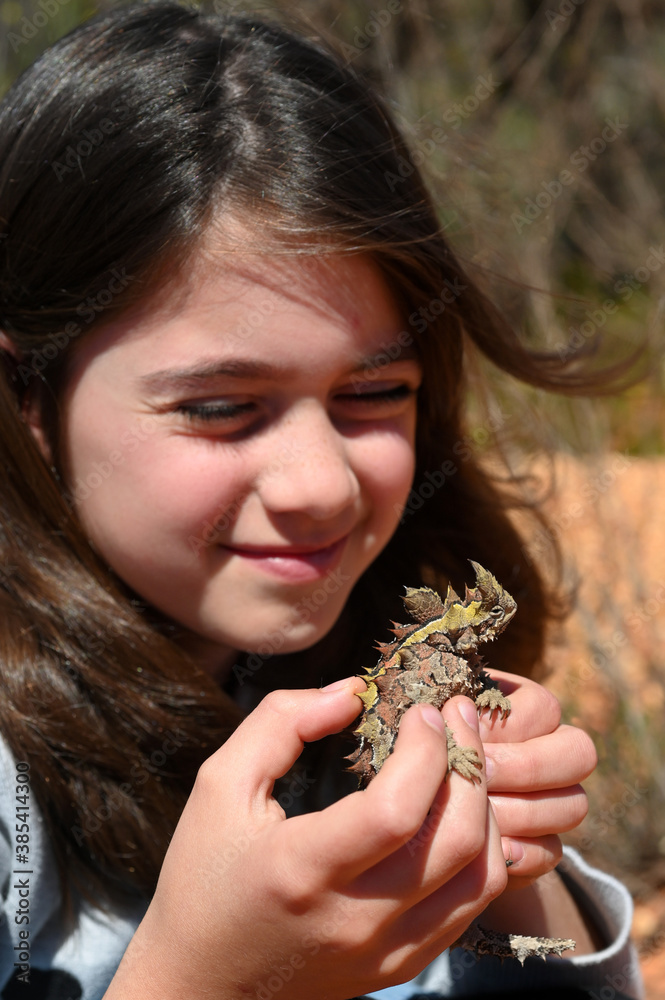 Young Australian girl holding a Thorny Devil Young Australian girl holding a Thorny Devil