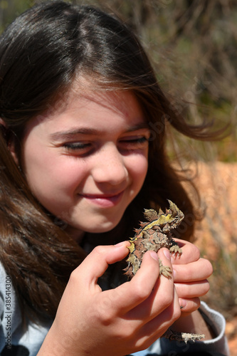 Young Australian girl holding a Thorny Devil