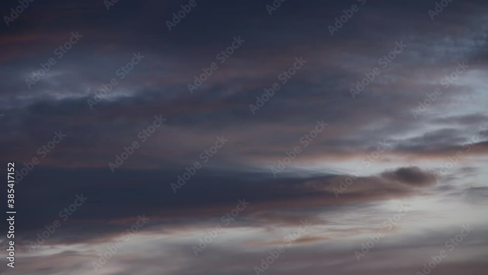 Vanishing new moon behind moving clouds. Time-lapse Vanishing new moon behind moving clouds. Time-lapse