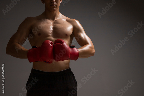 muscular boxer with red boxing gloves bumping fists