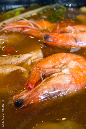 Closeup of Shrimps in Sinigang na Hipon Soup. A popular Filipino soup or stew characterized by its sour and savoury taste. photo