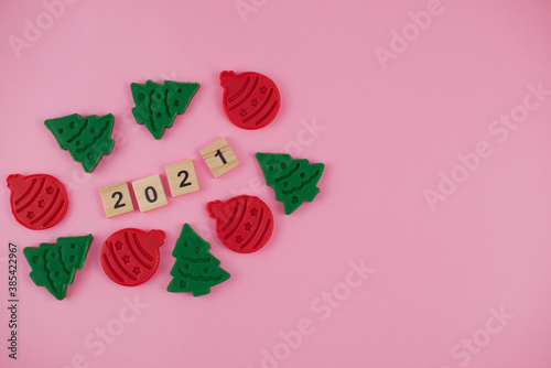 Happy New Year and Merry Christmas. Scrabble letters, playdough and plasticine. Letter tiles spelling celebration holiday.