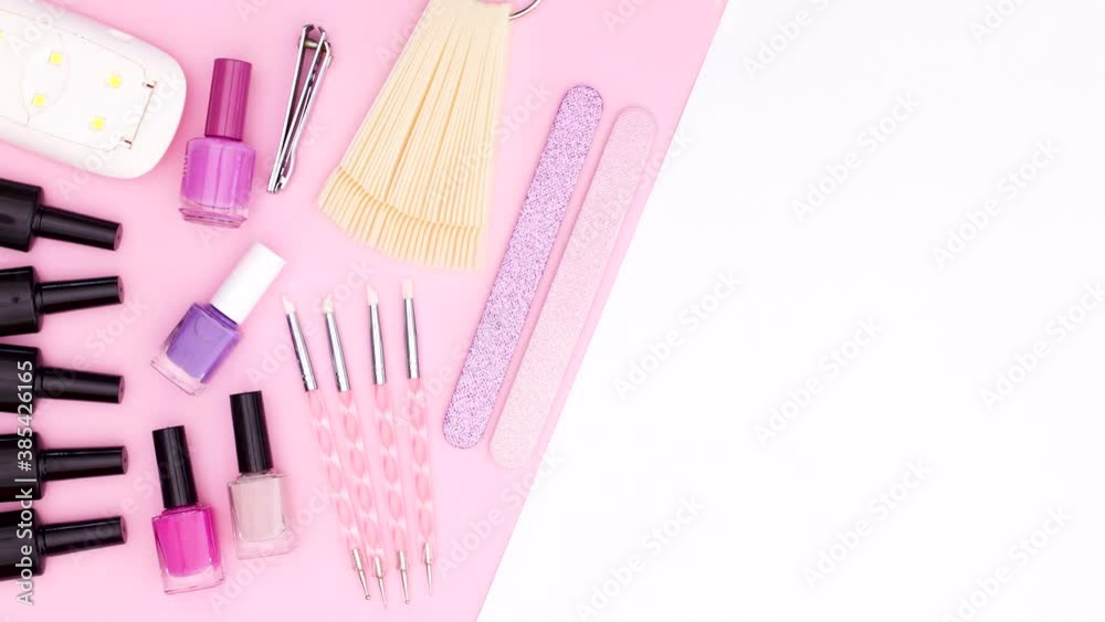 Manicure tools appear on pink side of pink white theme. Stop motion Manicure tools appear on pink side of pink white theme. Stop motion