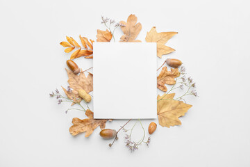 Beautiful autumn composition with empty card on white background