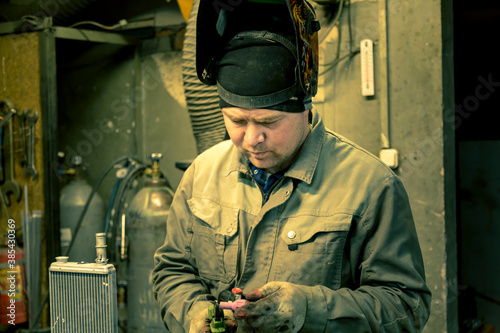 Close-up portrait of a welder in the workplace