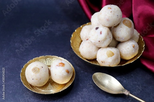 Rawa Ladu, Rava coconut Laddu or Semolina balls. It's a sweet dish from Maharashtra, India. Made using semolina, coconut & sugar. Its famous for festivals like, Diwali, Dussehra, Navratri. copy space