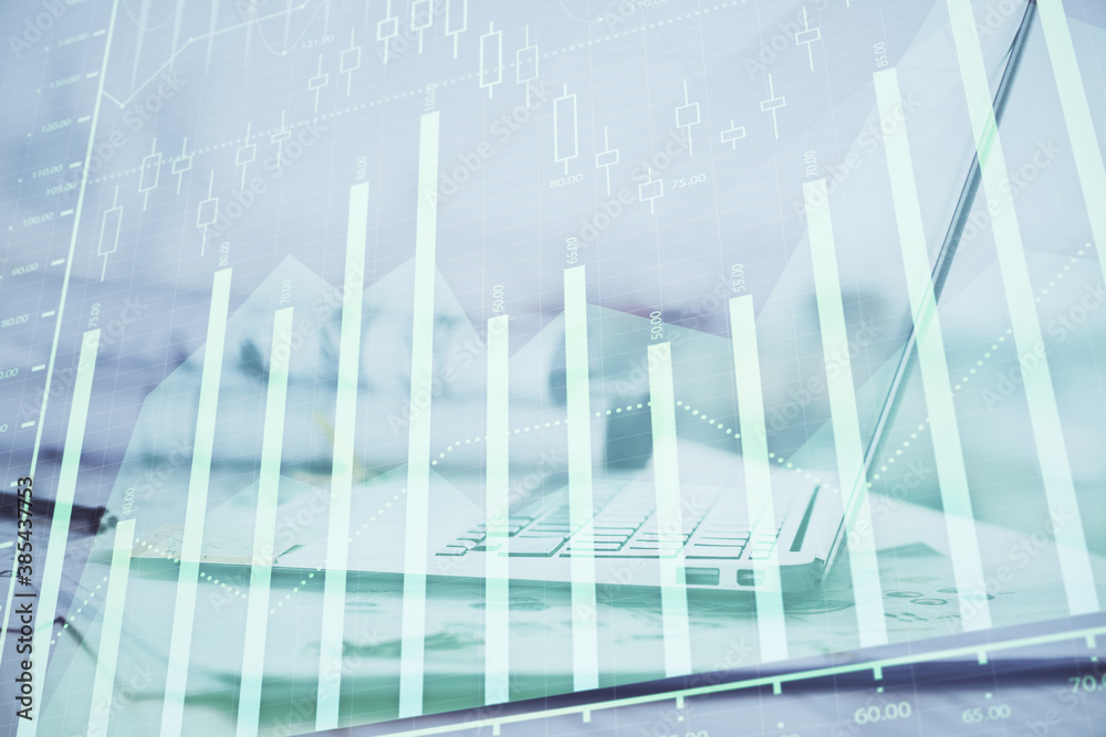 Forex graph hologram on table with computer background. Multi exposure. Concept of financial markets. Forex graph hologram on table with computer background. Multi exposure. Concept of financial markets.